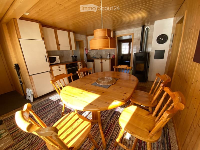 {"type": "Furnished Room", "objects": ["table", "chair", "refrigerator", "microwave", "oven", "dishwasher", "wooden cabinet", "wooden chair", "wooden table", "wooden cabinet", "wooden chair", "wooden chair", "wooden chair", "wooden chair", "wooden chair",