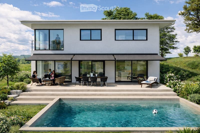 Modern two-story house with large glass windows and a spacious outdoor area featuring a swimming pool, lounge chairs, and a dining set.