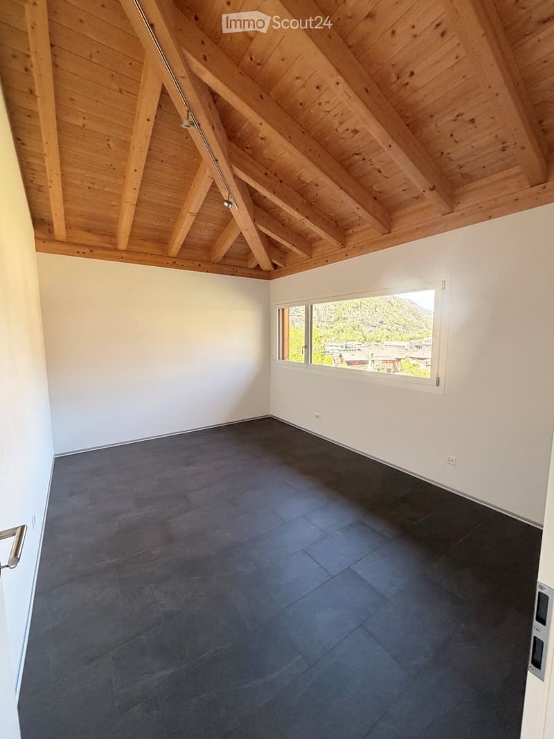 empty room, wooden ceiling, white walls, black tiled floor, large window with view
