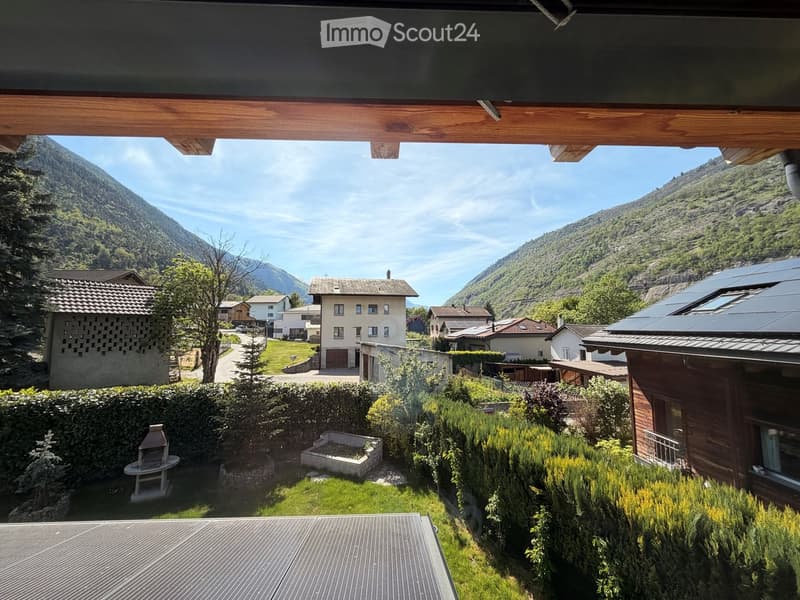 Mountain view, houses, greenery, solar panels