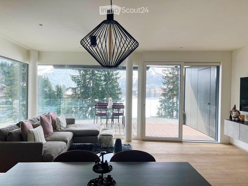 large windows, balcony, modern furniture, wooden floor, large sofa, dining table, modern pendant light