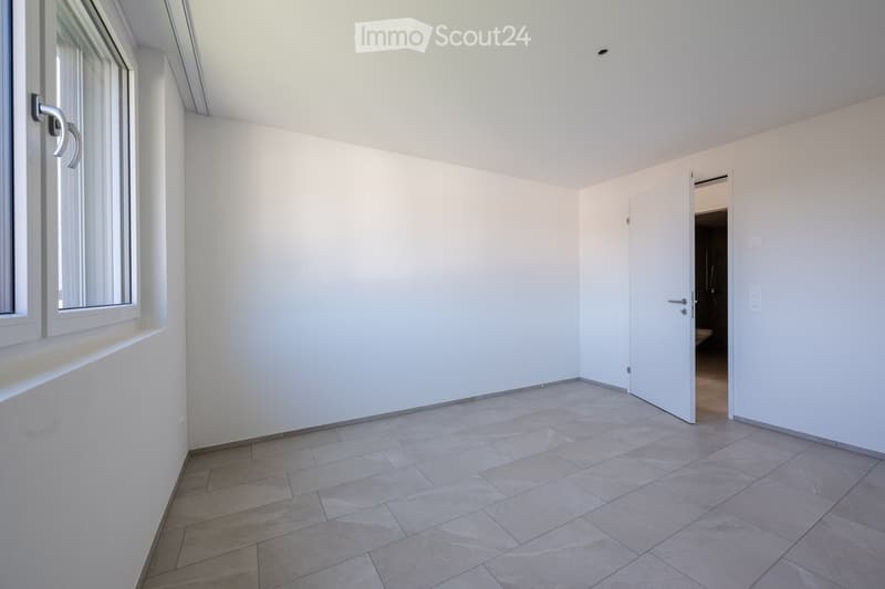 empty room, light tiles, white walls, open door, window, power outlets
