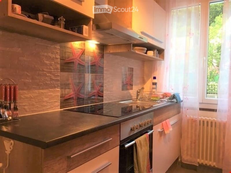 modern kitchen, granite countertop, gas stove, oven, sink, dishwasher, white cabinets, white curtains, window with view