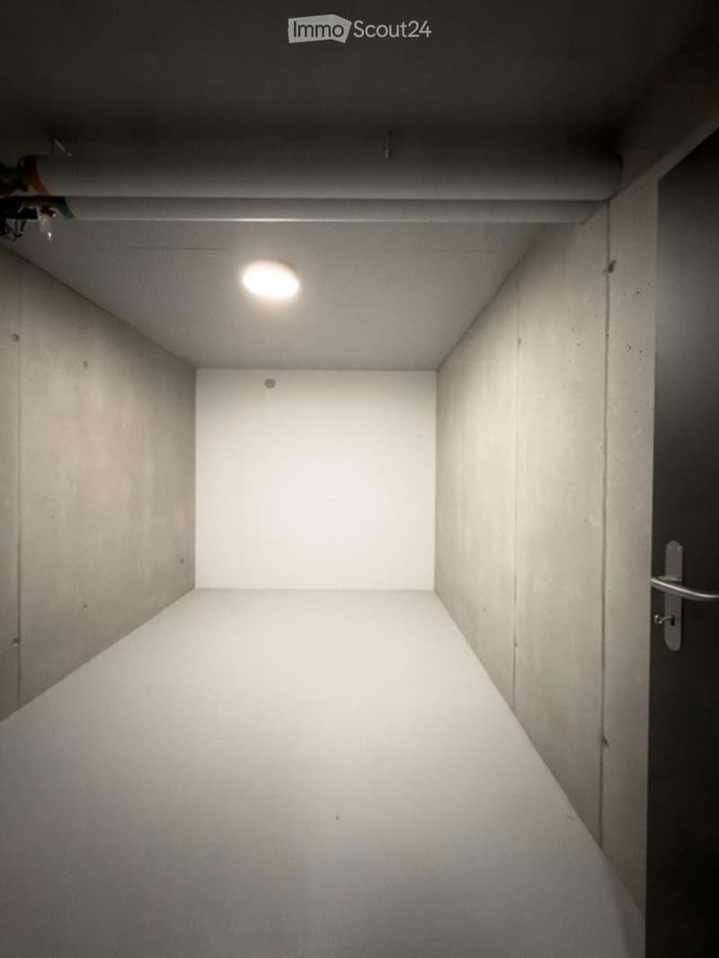 Completely empty room with bare walls and a white floor. No furniture or equipment.