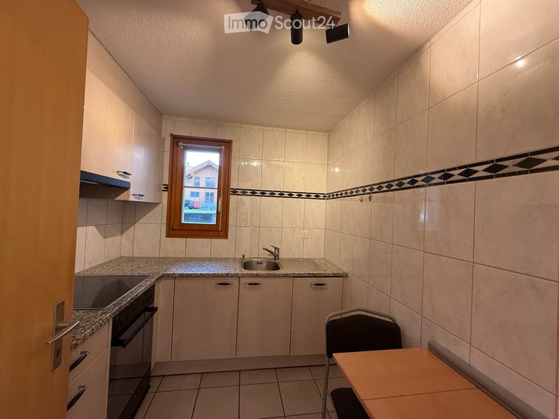 modern kitchen, white tiles, marble countertop, built-in cabinets, oven, sink, dishwasher