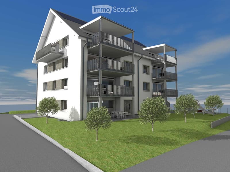 Modern multi-story residential building with balconies, surrounded by a well-maintained lawn and trees.