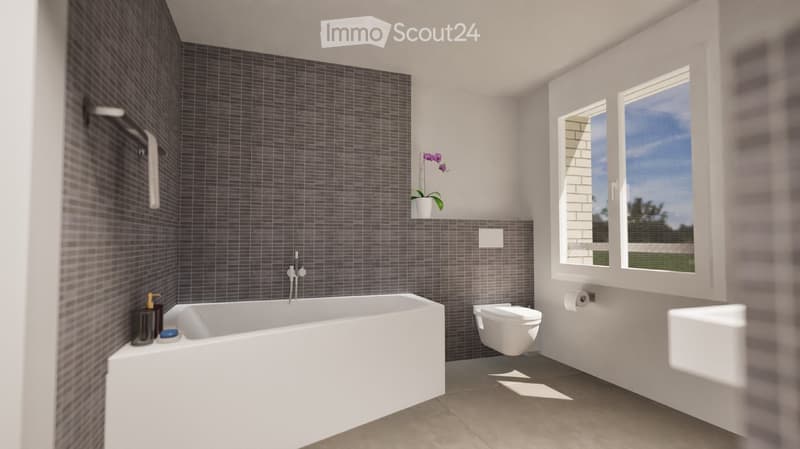 Modern bathroom with a bathtub, toilet, sink, and large windows letting in natural light. The walls are tiled in dark gray, and there is a small decorative plant on the windowsill.