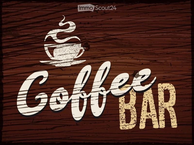 Graphic design featuring a coffee cup and the text "Coffee Bar" on a wooden background.