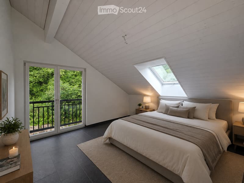 Modern bedroom with a large bed, nightstands, lamps, a small table with a plant, and a candle. Large windows and a balcony offer a view of greenery.
