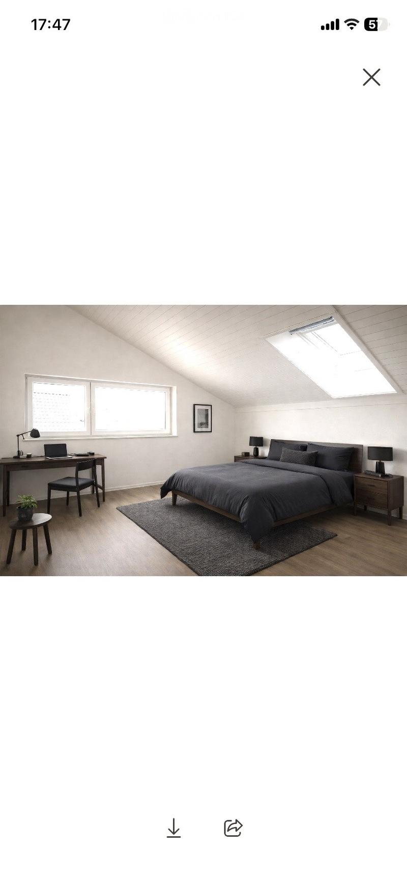 Modern bedroom with a large bed, nightstands, desk, chair, laptop, small stool, plant, and picture frame. The room features wooden flooring, large windows, and skylights.