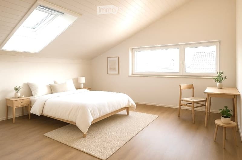 Bright, airy bedroom with wooden flooring, large windows, skylight, and modern furnishings including a bed, nightstand, chair, table, and plants.