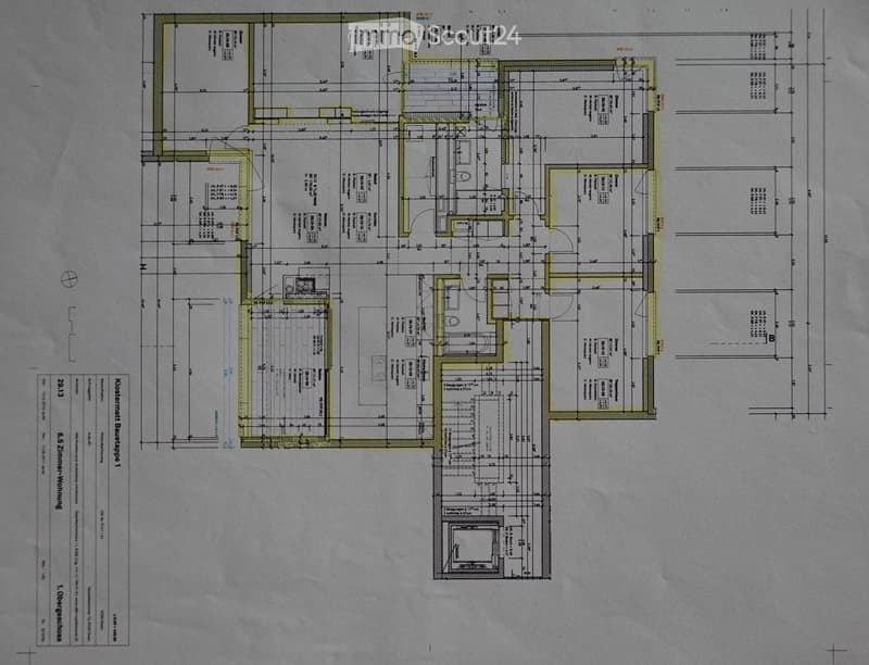 Floor plan of a residential building showing multiple rooms including living area, bedrooms, bathrooms, and kitchen.