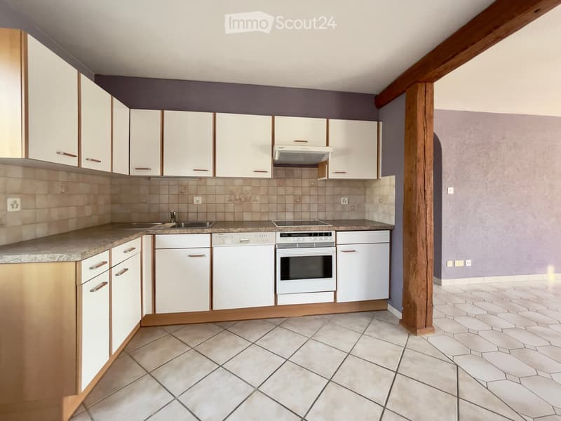 Tiled floor, white countertops, white cabinets, white gas stove, white oven, white dishwasher, white refrigerator, wooden beams