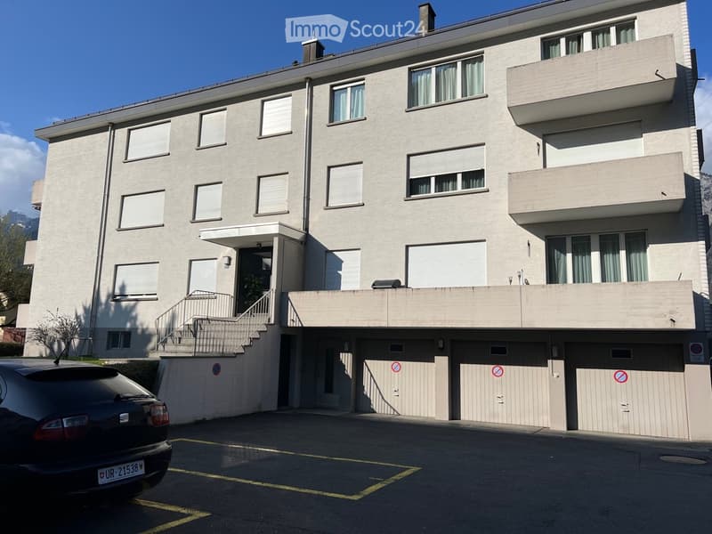 {"visible_features": ["Parking place"],"type": "Apartment building","description": "3-story apartment building with beige exterior, multiple balconies, and a parking area with designated parking spots below the building."}