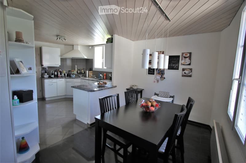 {"type": "Furnished Room", "objects": ["kitchen cabinets", "countertop", "sink", "faucet", "oven", "refrigerator", "microwave", "coffee maker", "table", "chair", "bowl", "cupboard", "picture frame", "fridge", "cupboard", "cupboard", "cupboard", "cupboard"