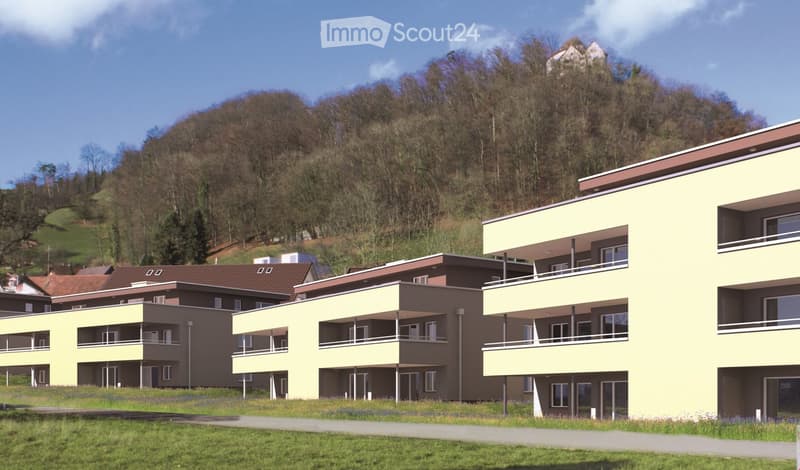 Apartments on a hillside with views of the surrounding hills and greenery