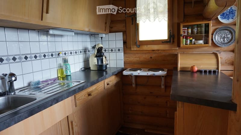 {"type": "Kitchen", "objects": ["sink", "faucet", "coffee maker", "electric stove", "bottle", "faucet", "faucet", "faucet", "faucet", "faucet", "faucet", "faucet", "faucet", "faucet", "faucet", "faucet", "faucet", "faucet", "faucet", "faucet", "faucet", "