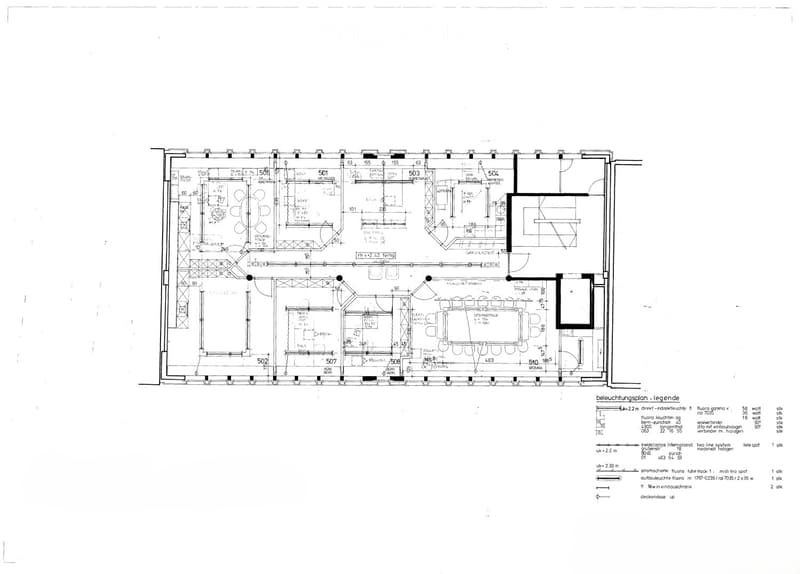 Floor plan of a multi-room building with labeled rooms and dimensions, including a reception area, offices, meeting rooms, and technical spaces.