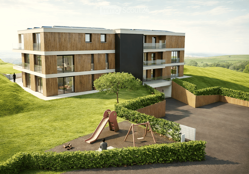 3 story building, wooden exterior, solar panels, balconies, playground