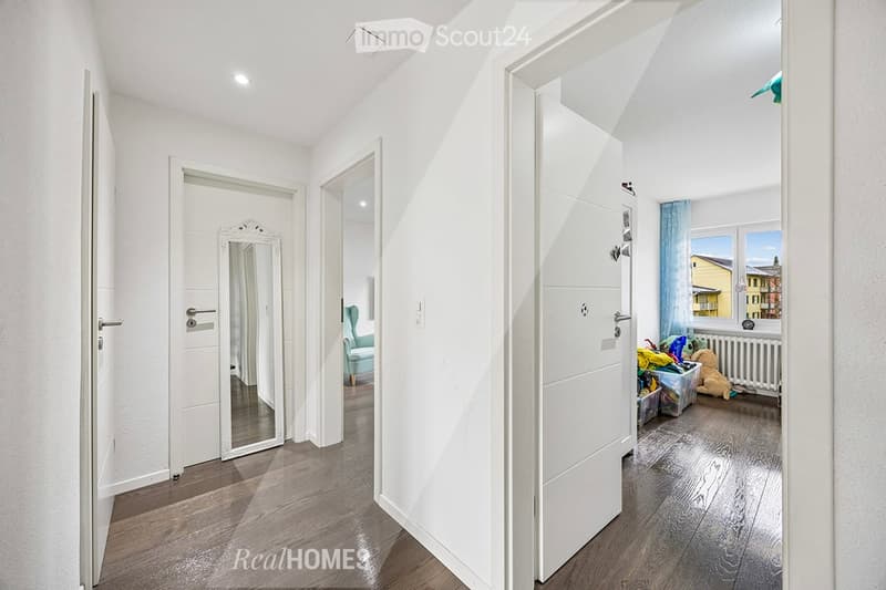 white walls, wooden floor, white doors, mirror, blue curtain, white radiator, toys