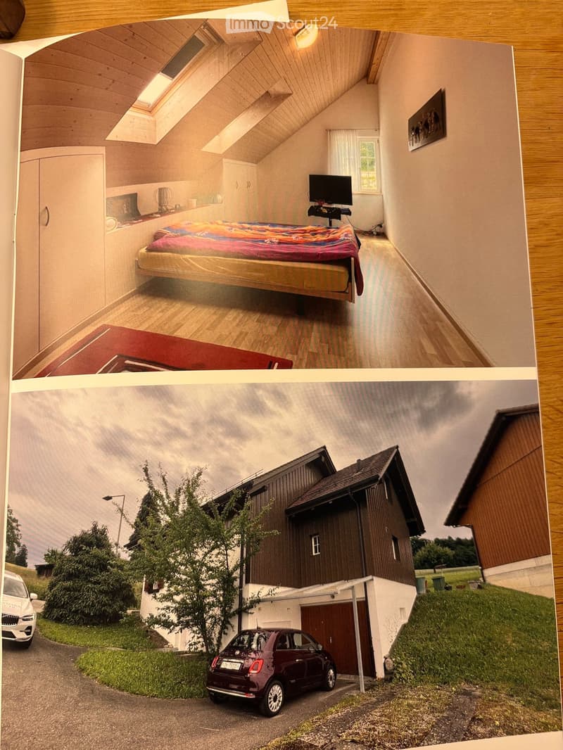 The image shows a two-page spread featuring a modern bedroom with a raised bed and a view of a contemporary house exterior with a garage and parked cars.