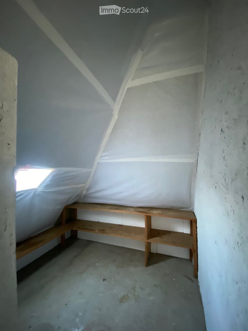 attic room, unfinished, wooden bench, slanted roof, small window