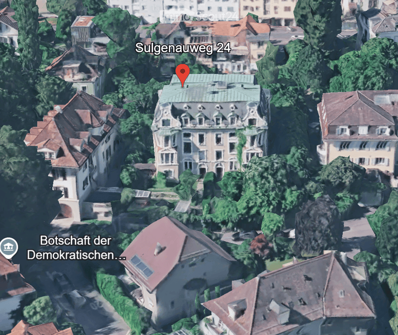 Aerial view of a residential area with multiple buildings, trees, and a marked location at Sulgenauweg 24.