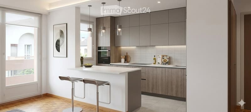 Modern kitchen with a white island, bar stools, pendant lights, and various appliances including an oven and sink.