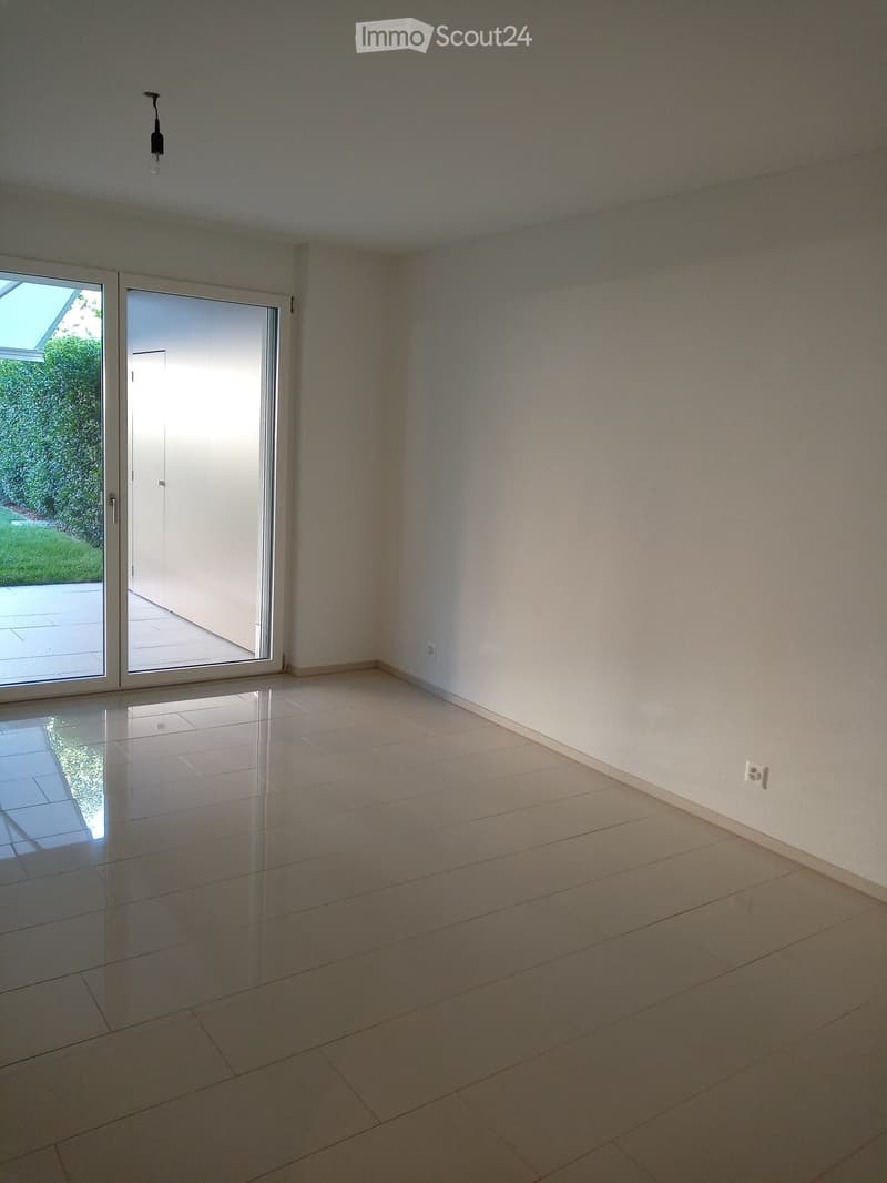 empty room, white walls, white tiles, sliding glass door, power outlet