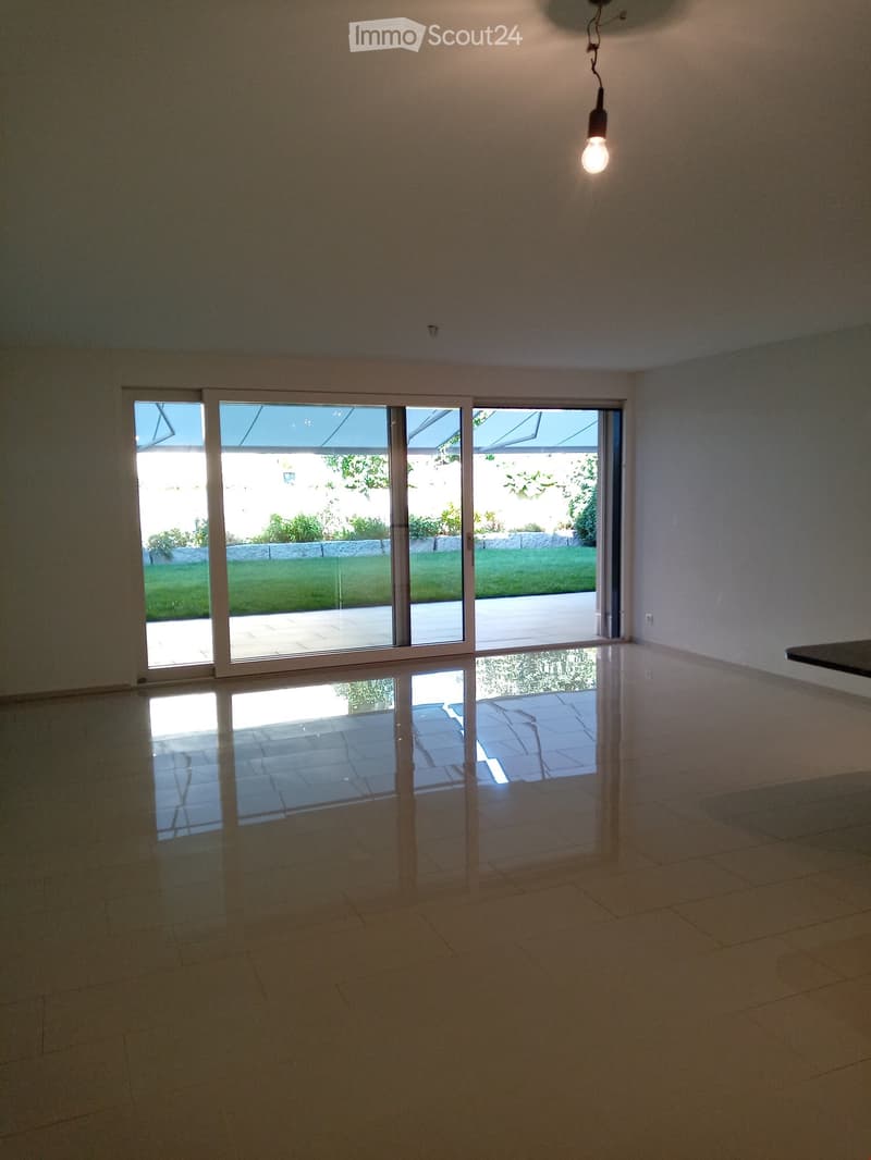 empty room, large glass doors, tiled floor, light on ceiling