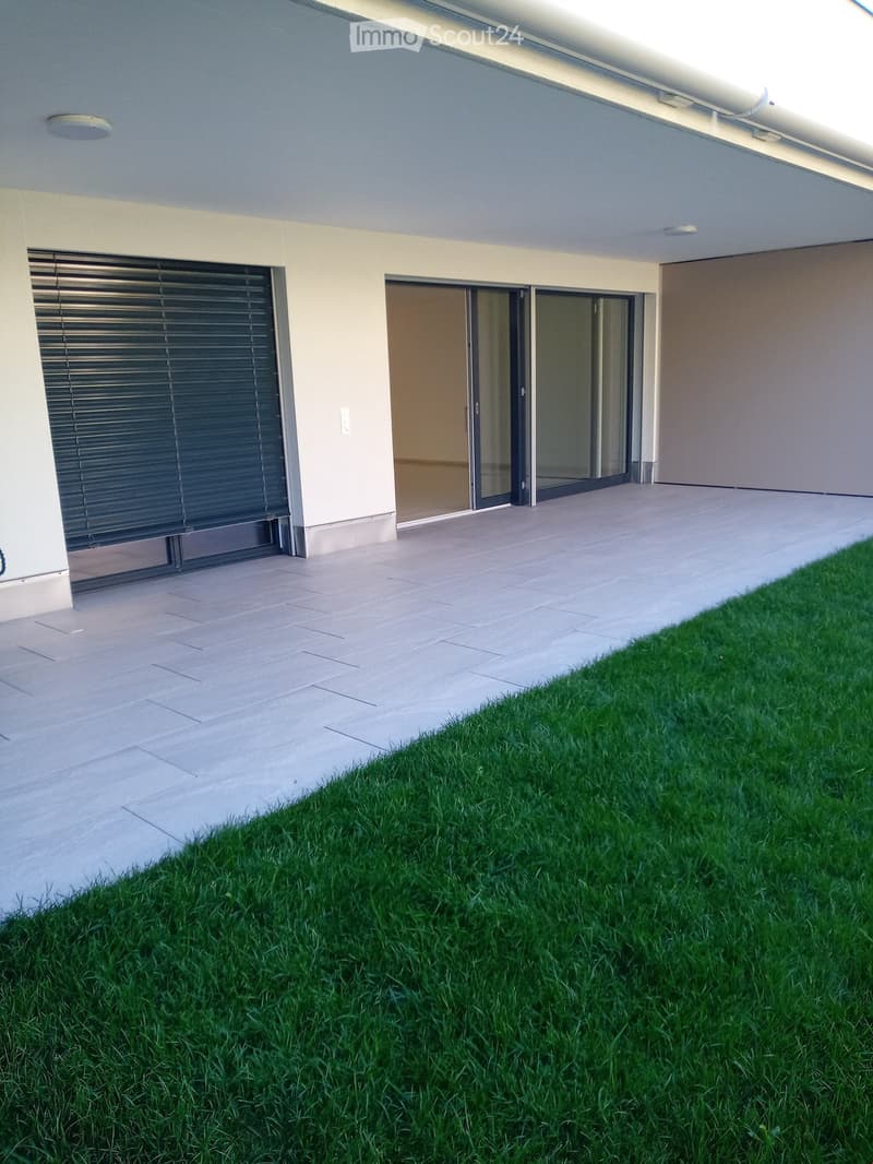 tiled floor, closed garage, sliding glass doors, grassy lawn