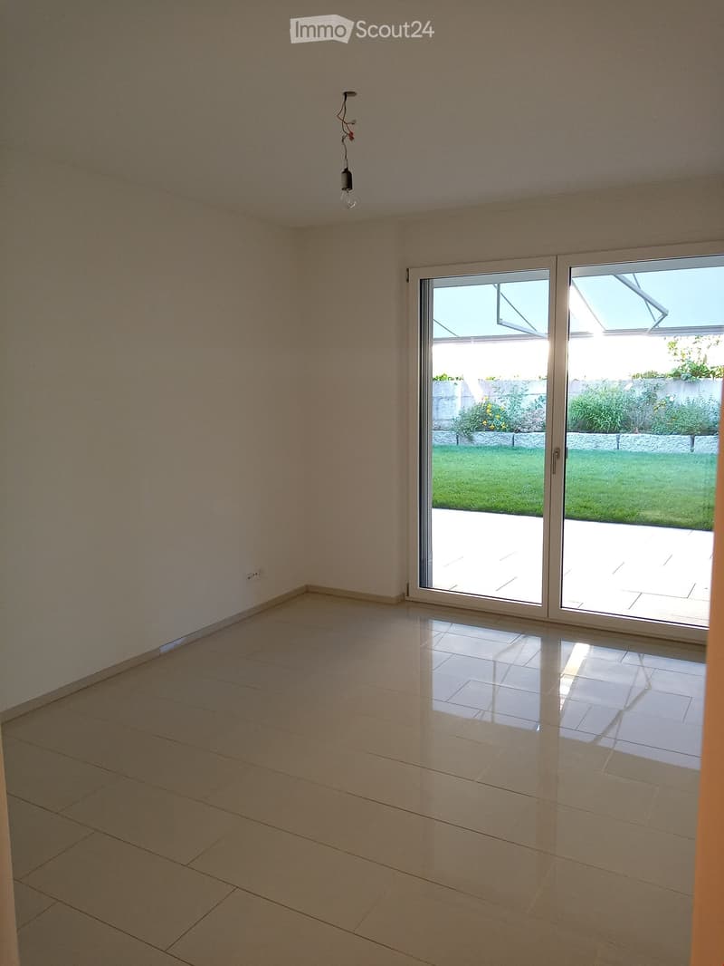empty room, white walls, white tile floor, sliding glass door, outdoor grass