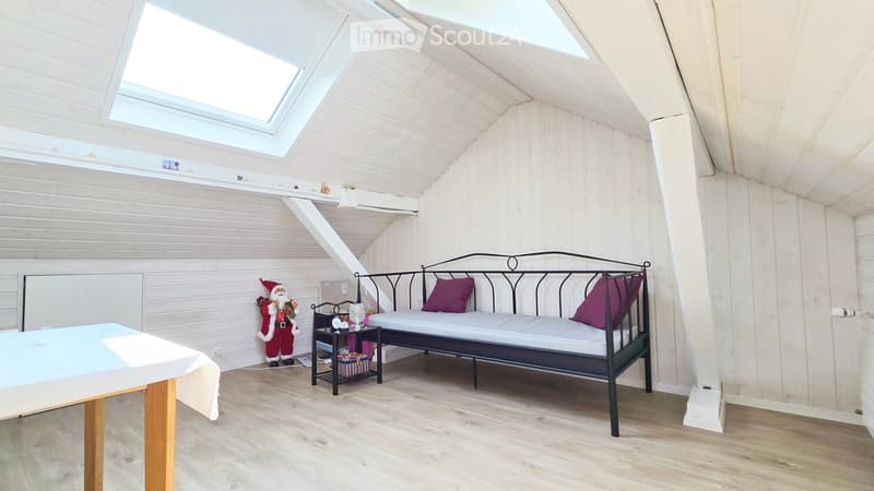 Skylight, bed, side table, desk, Santa Claus figurine