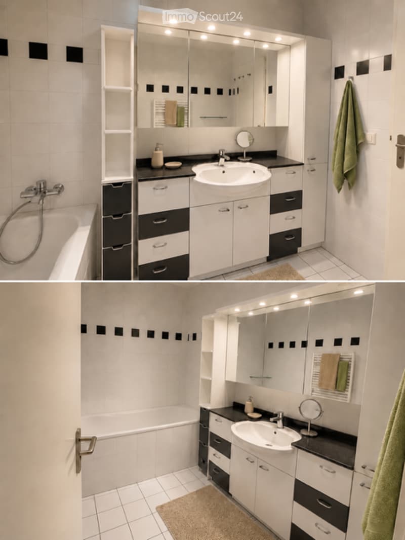 Modern bathroom with white tiles, black accents, a large mirror, a sink, a bathtub, and built-in cabinets.