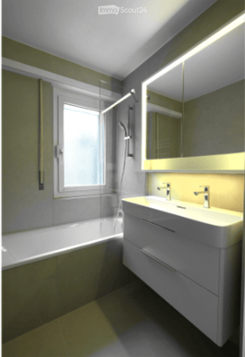 Modern bathroom with a bathtub, sink, and shower. Features a large mirror above the sink and a window for natural light.