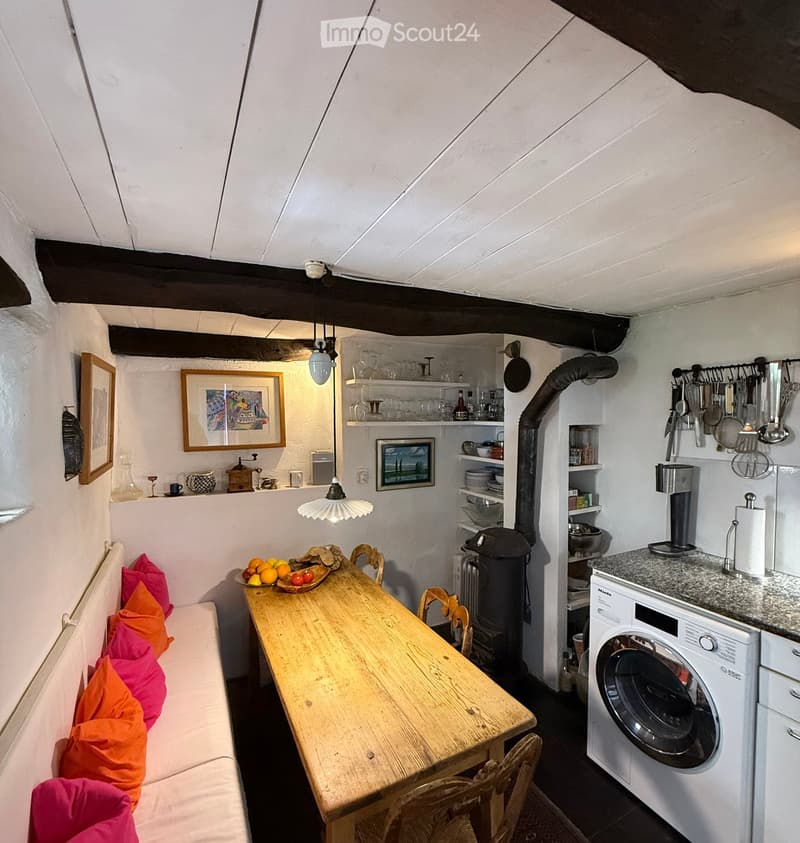 {"type": "Furnished Room", "objects": ["sofa", "table", "chair", "washing machine", "cupboard", "framed picture", "cup", "bowl", "faucet", "cupboard", "cupboard", "cupboard", "cupboard", "cupboard", "cupboard", "cupboard", "cupboard", "cupboard", "cupboar