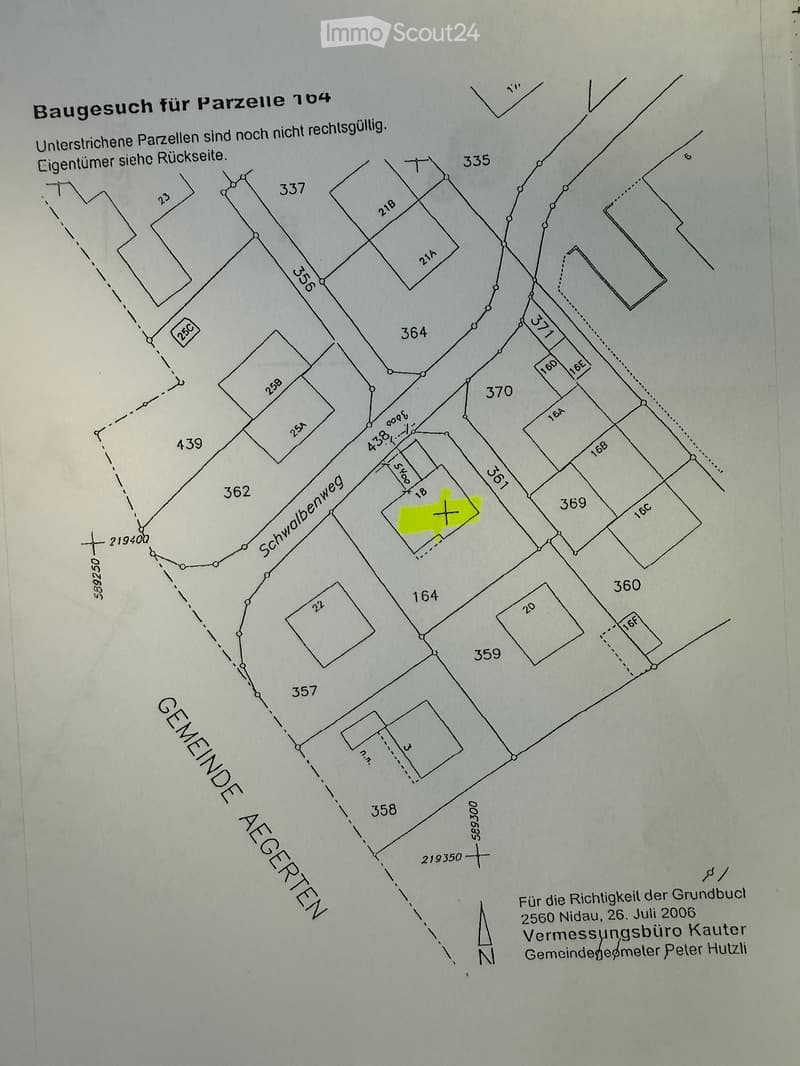 Floor plan showing multiple plots and parcel numbers, with highlighted parcel 184 in yellow.