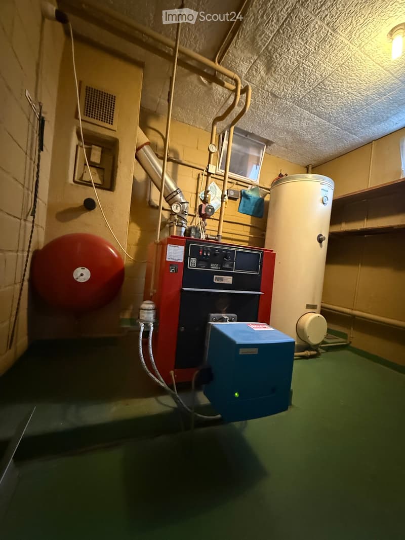 Storage room with HVAC equipment, boiler, and water heater