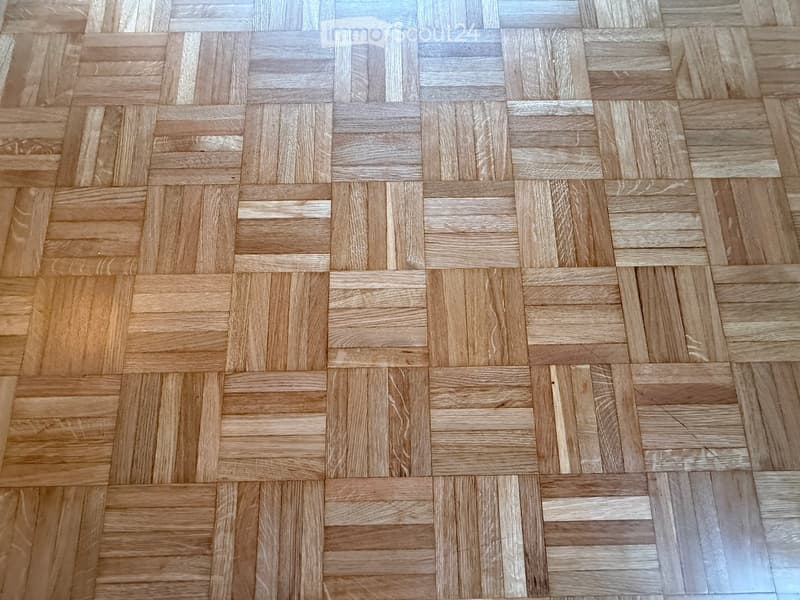 Wooden parquet flooring with small diamond-shaped pieces