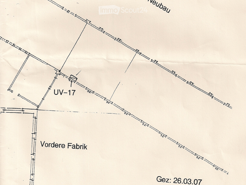 Floor plan showing a building layout with labeled sections including 'UV-17', 'Vordere Fabrik', and 'Neubau'.