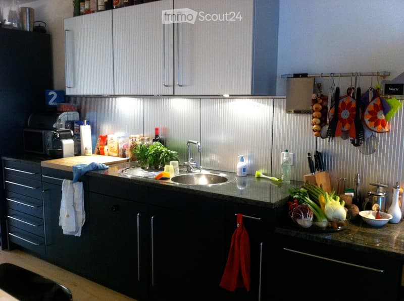 {"type": "Kitchen", "objects": ["sink", "faucet", "cutting board", "bowl", "cup", "bottle", "faucet", "oven", "microwave", "cupboard", "fridge", "oven", "fridge", "oven", "cupboard", "cupboard", "cupboard", "cupboard", "cupboard", "cupboard", "cupboard",