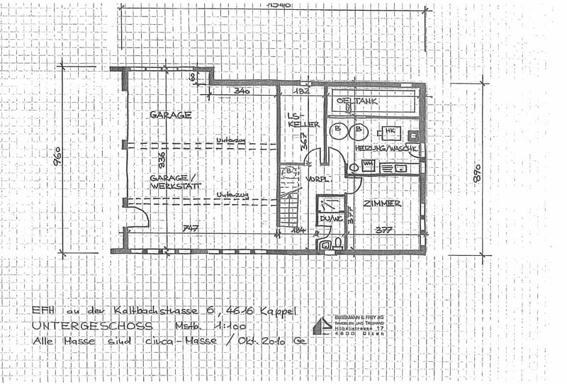 Floor plan of a basement level showing a garage, workshop area, utility room, heating system, and a small room.