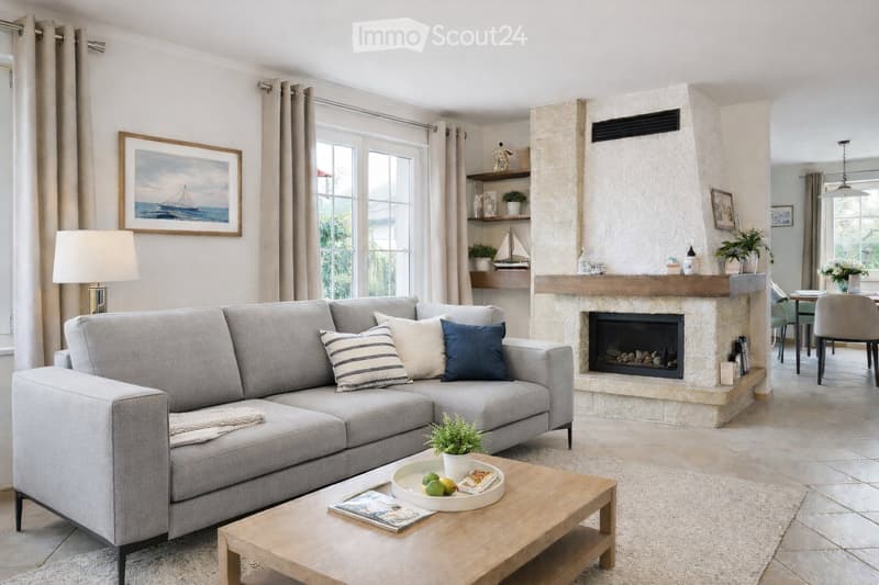 Modern living room with a grey sectional sofa, wooden coffee table, fireplace, large windows, and decorative items.