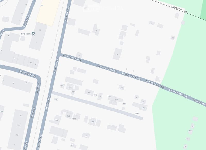 Map showing a residential area with numbered buildings and streets including Lettackweg, Stettengrabenweg, Haselrain, and Grünbodenweg.