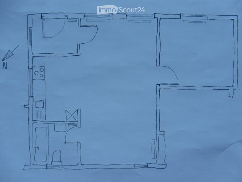 Floor plan of a house with a living room, kitchen, bedroom, bathroom, and hallway.