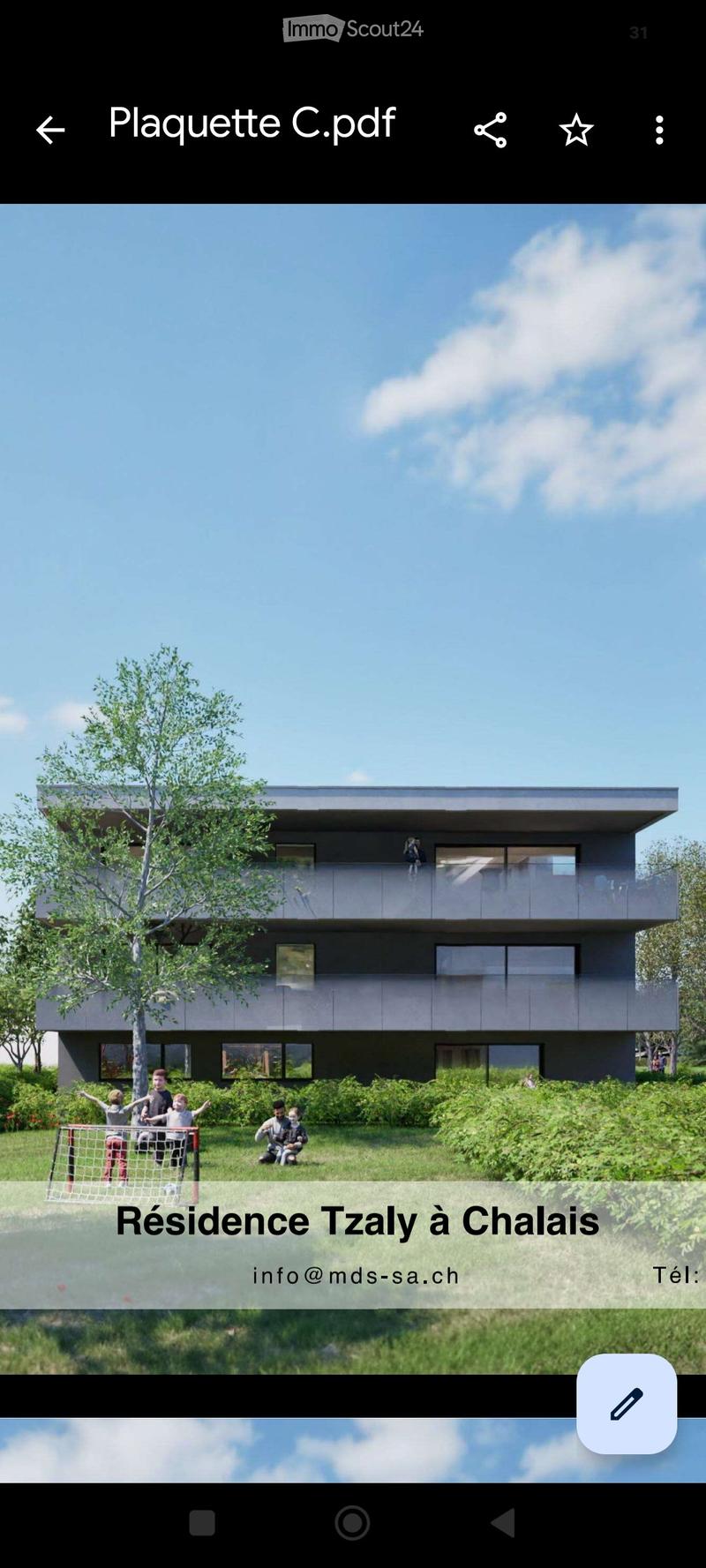 Modern two-story house with large windows and a balcony, surrounded by greenery and a small soccer net in the foreground.
