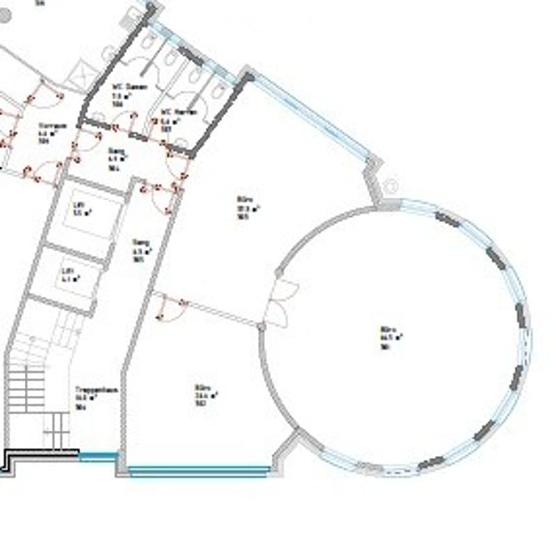 Floor plan of a building with multiple rooms, including a large circular room, several smaller rooms, and corridors.