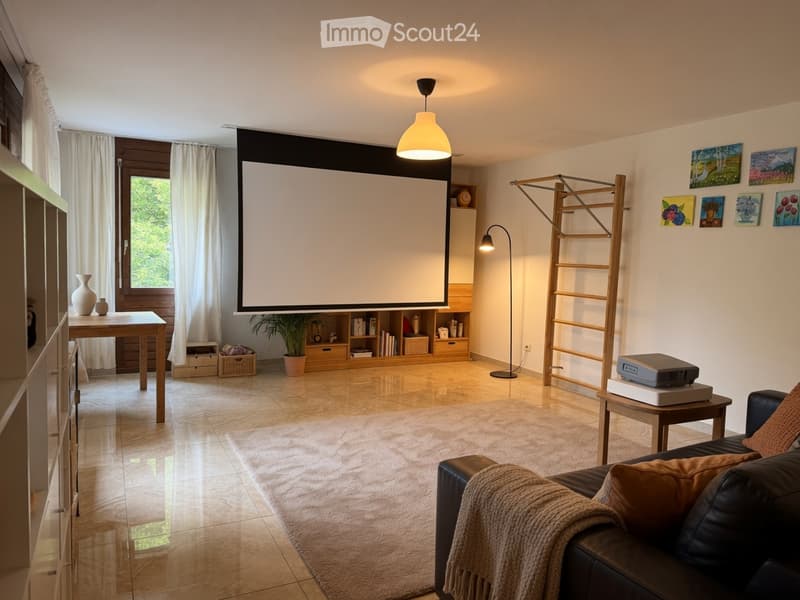 Modern living room with a large screen, leather sofa, coffee table, bookshelf, and decorative vases.