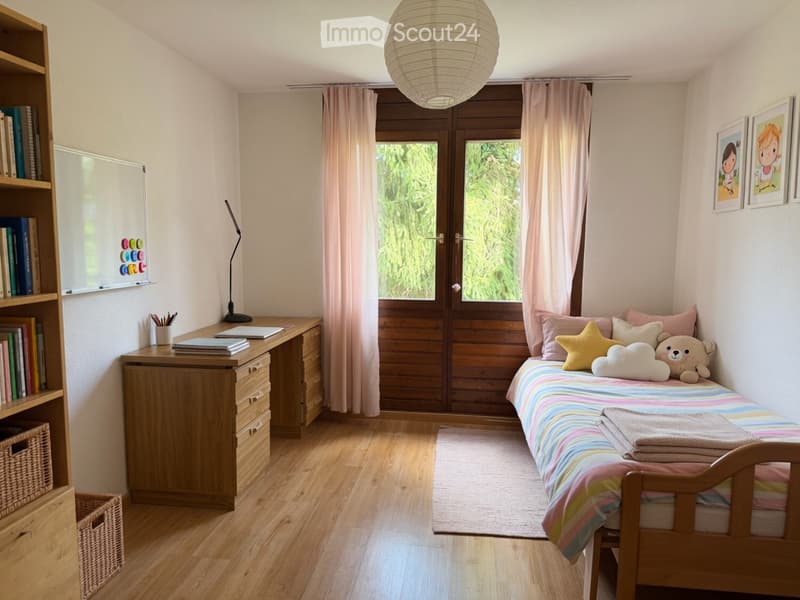 Cozy children's bedroom with a single bed, colorful bedding, a wooden desk, bookshelf, and a large window with curtains.