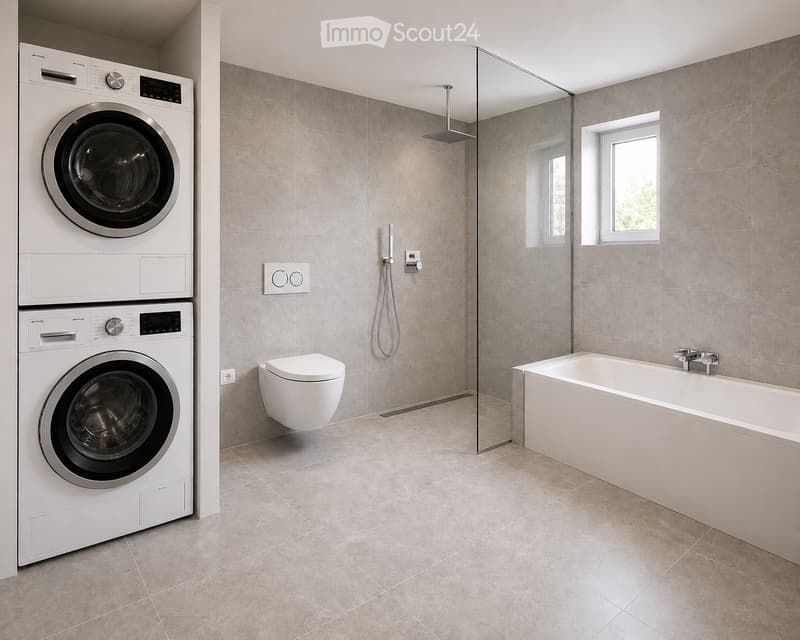 Modern bathroom with a bathtub, toilet, washing machine, and a glass-enclosed shower area. The walls and floor are tiled in a neutral gray color.